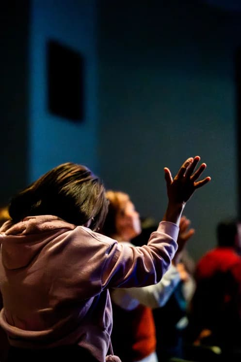 Congregation in worship, warm light